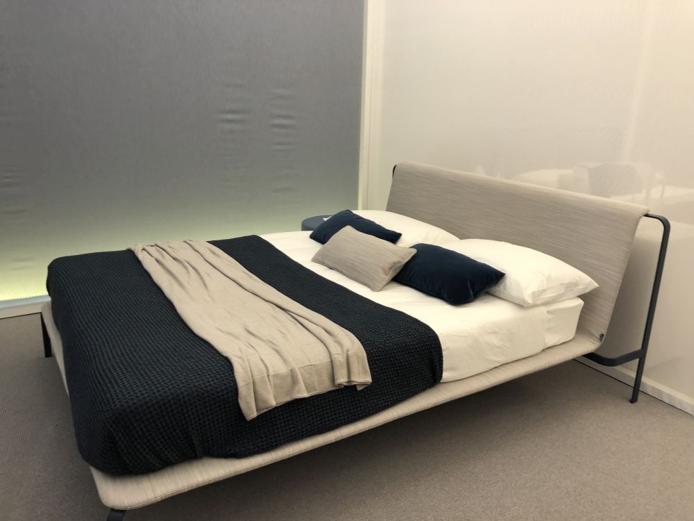 Black bed frame and light shade of gray