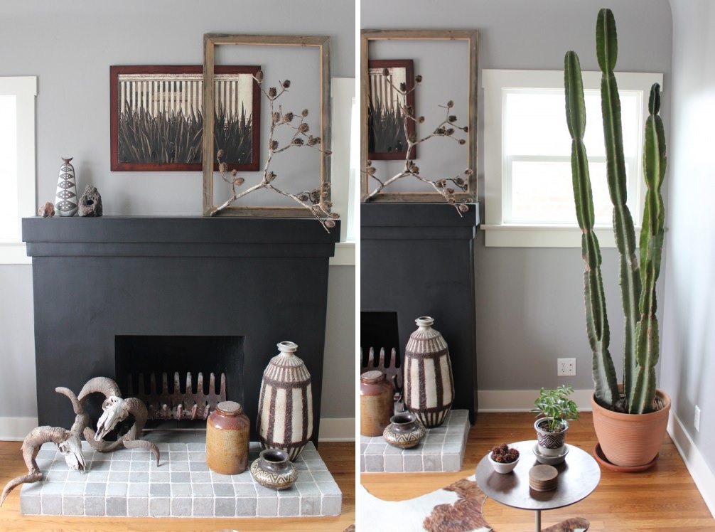 Black fireplace design with empty frames on mantel