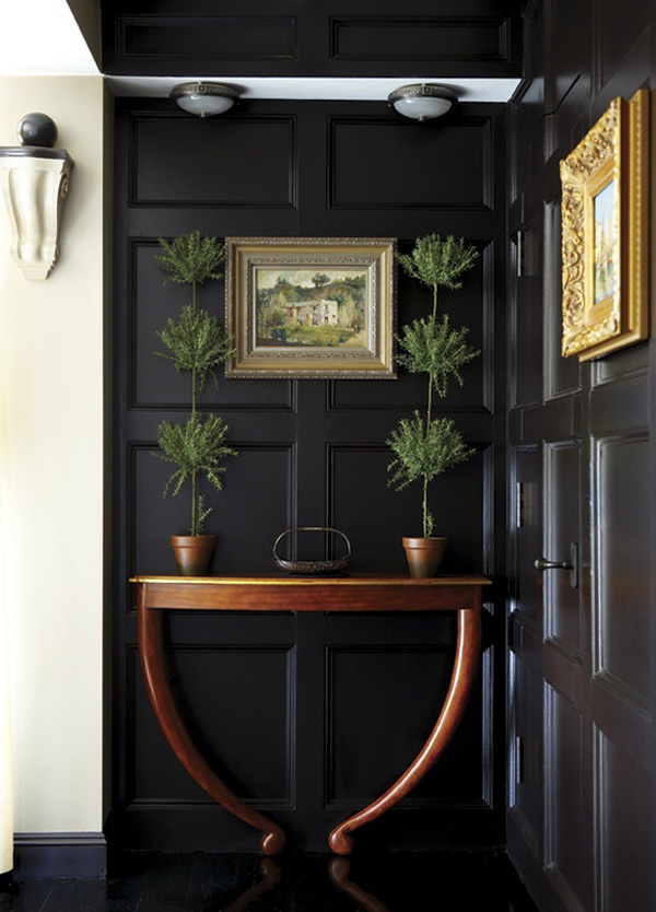 Black foyer design with wood paneling