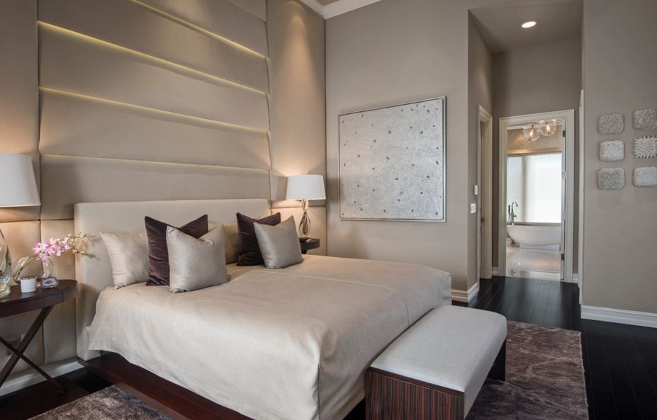 Black hardwood bedroom floor and modern headboard with lights