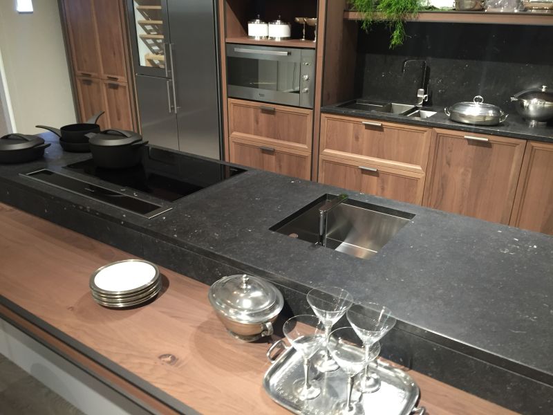 Black marble countertop and brown earth color cabinet