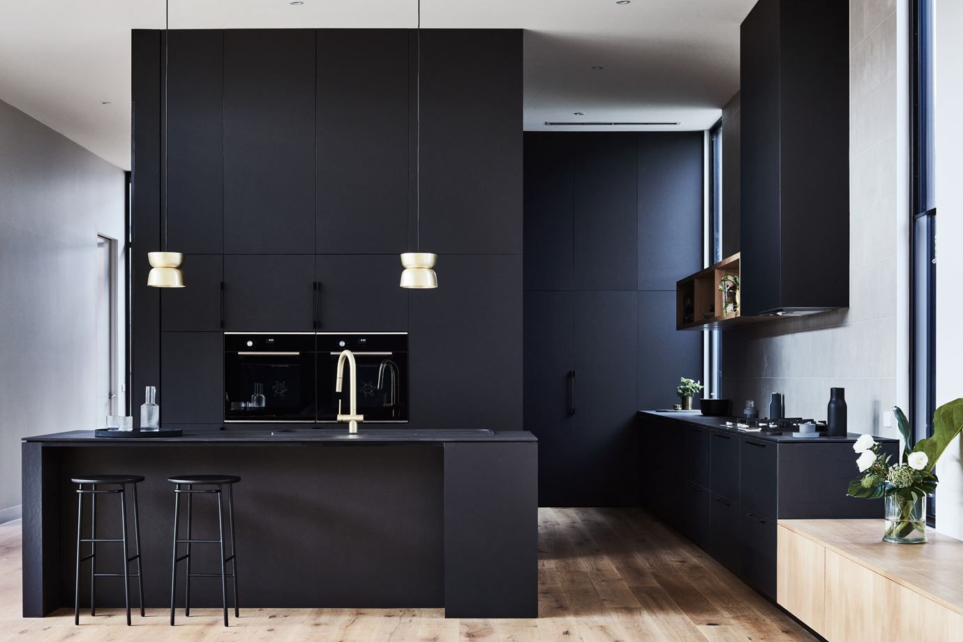 Black matt kitchen layout with built in appliances