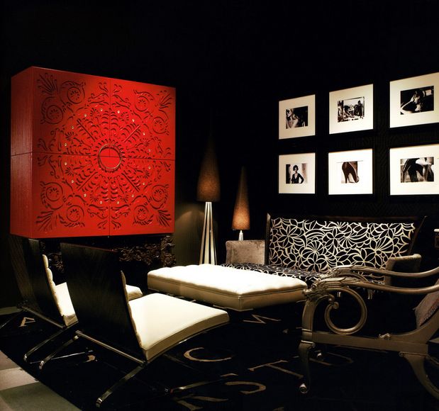 Black neutral room with bold red