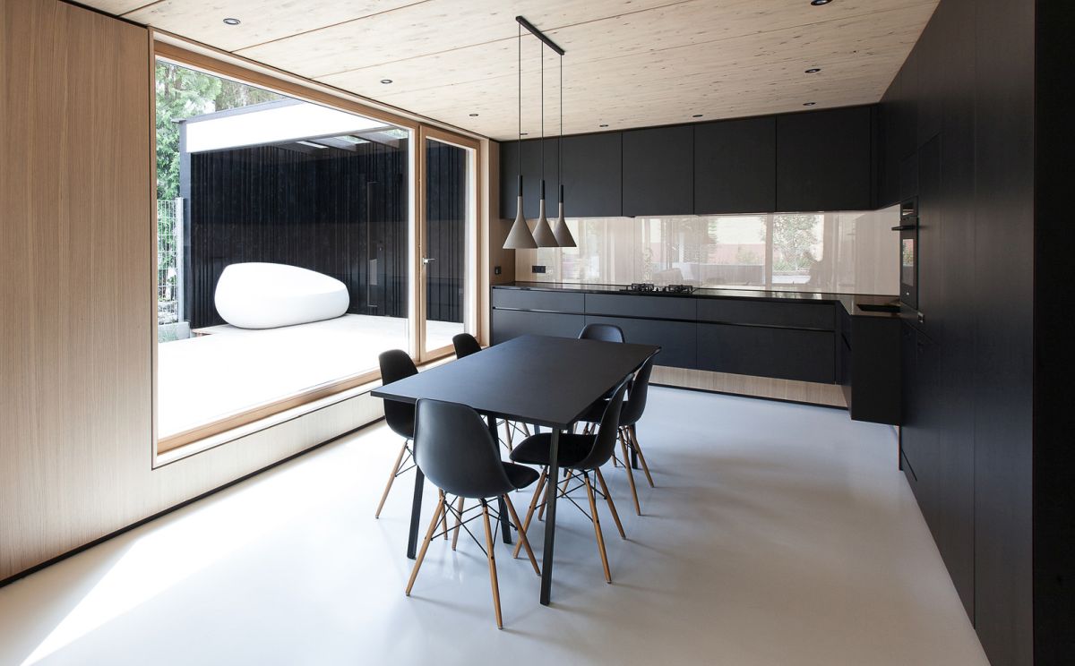 Black on wall kitchen design with small dining table