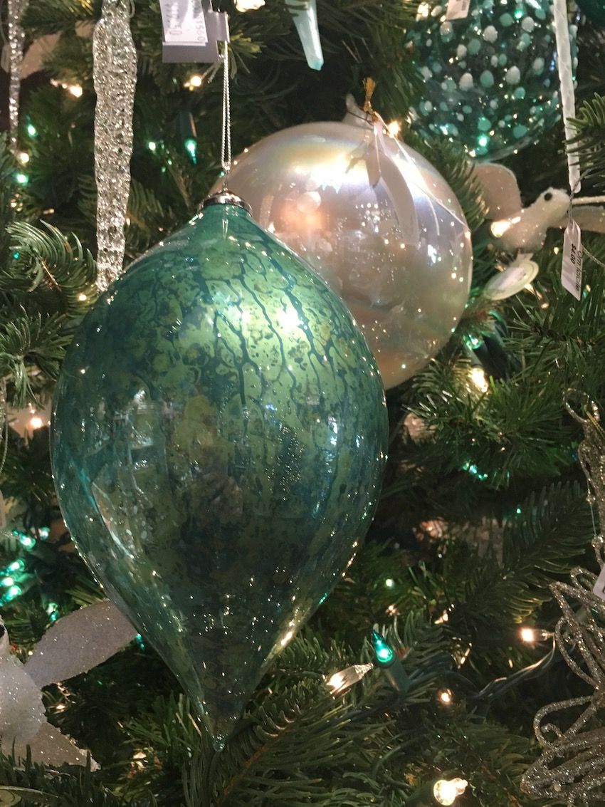 Crackled glass and a tapered shape make this simple ornament an elegant addition.