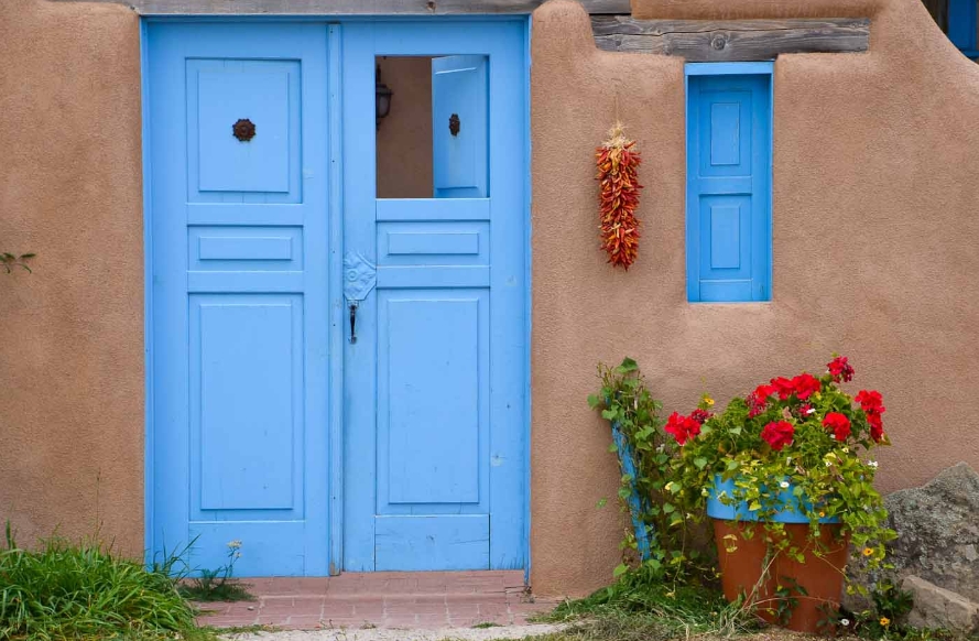 Blue Front Door with Adobe Exterior