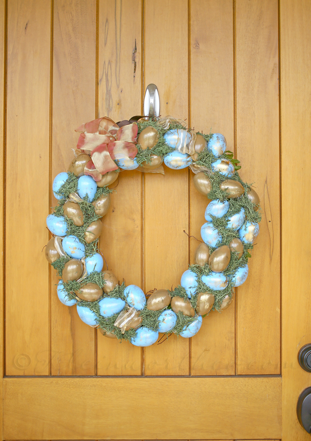 Blue and gold easter eggs on wreath