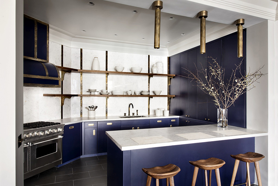 Blue shade kitchen cabinets with brass hardware