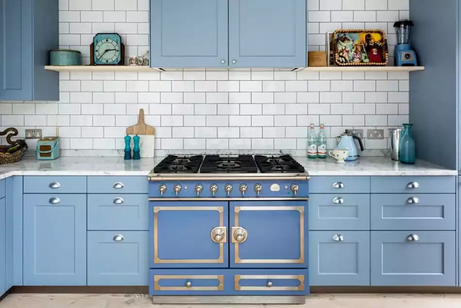 Blue shade kitchen cabinets and white subway tiles for backsplash