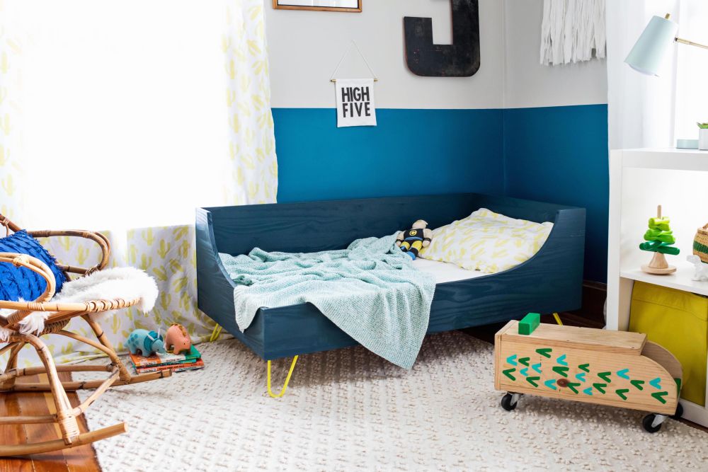 Blue toddler bed with yellow hairpin legs