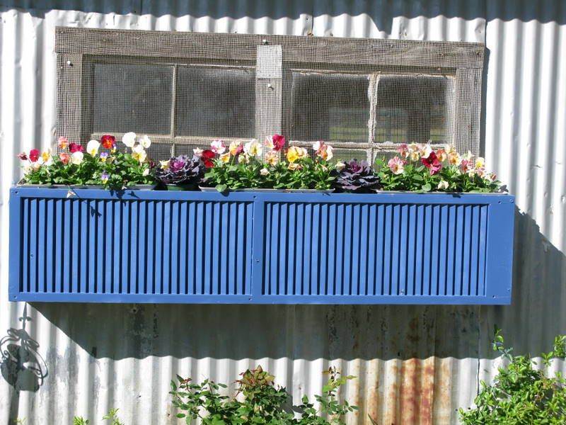 Blue window planter from wooden shutters