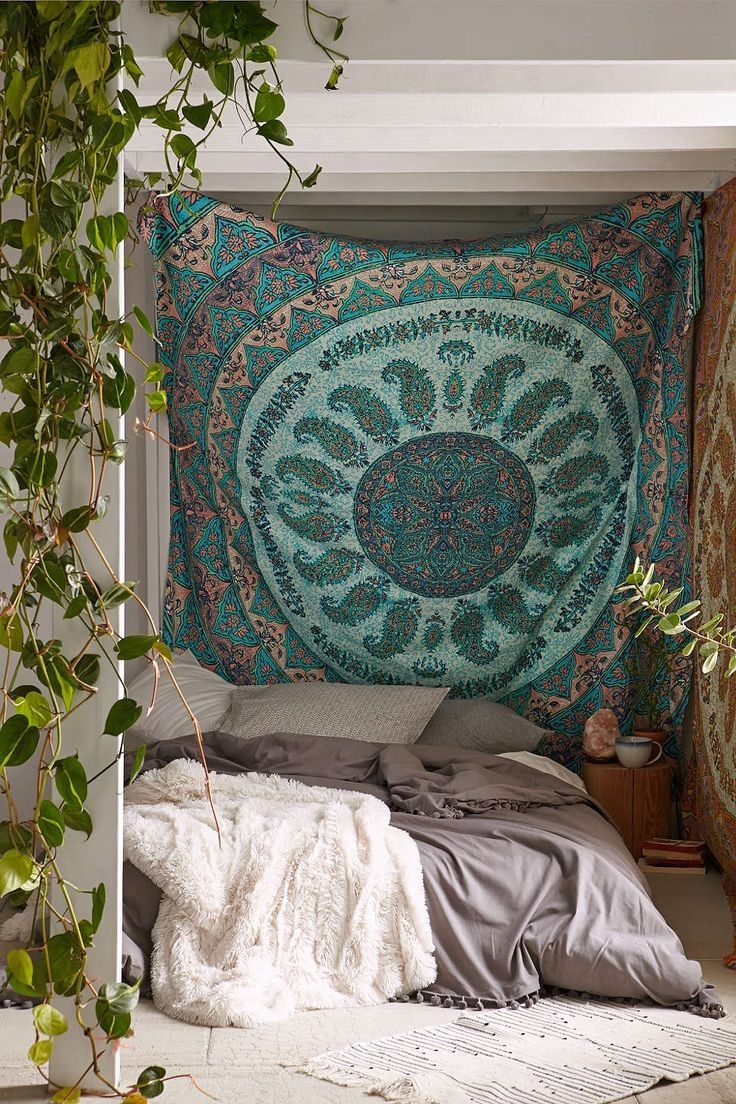 Bohemian bedroom with tapestry headboard