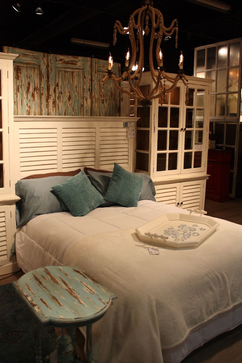 Doors, shutters and other reclaimed pieces can be used as a headboard. This one is from Bramble.