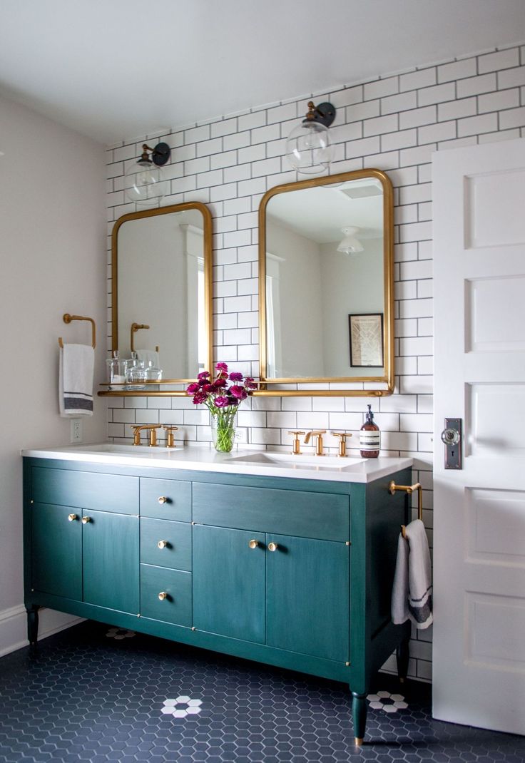 Brass bathroom accents and subway tiles
