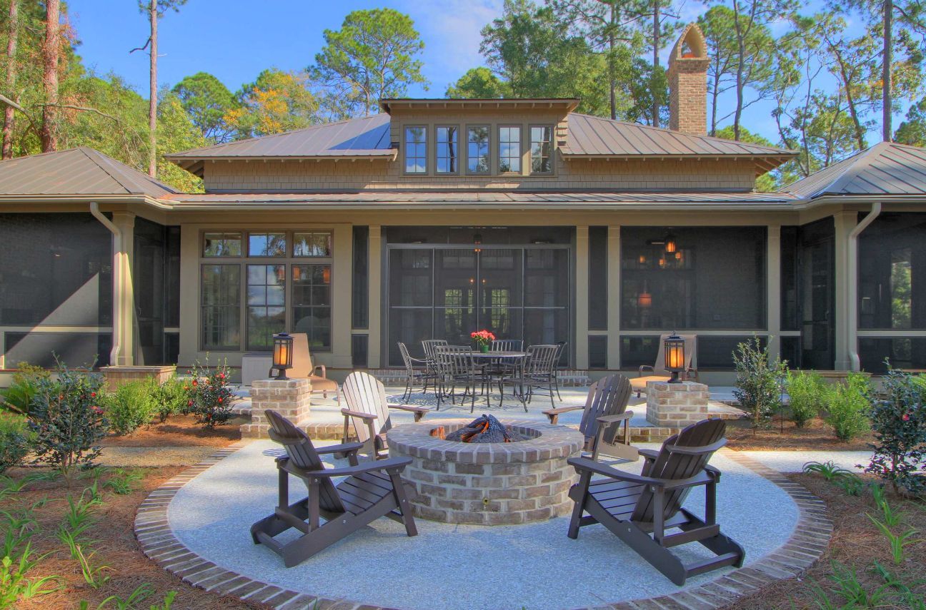 Brick fire pit with modern iconic Adirondack Chairs