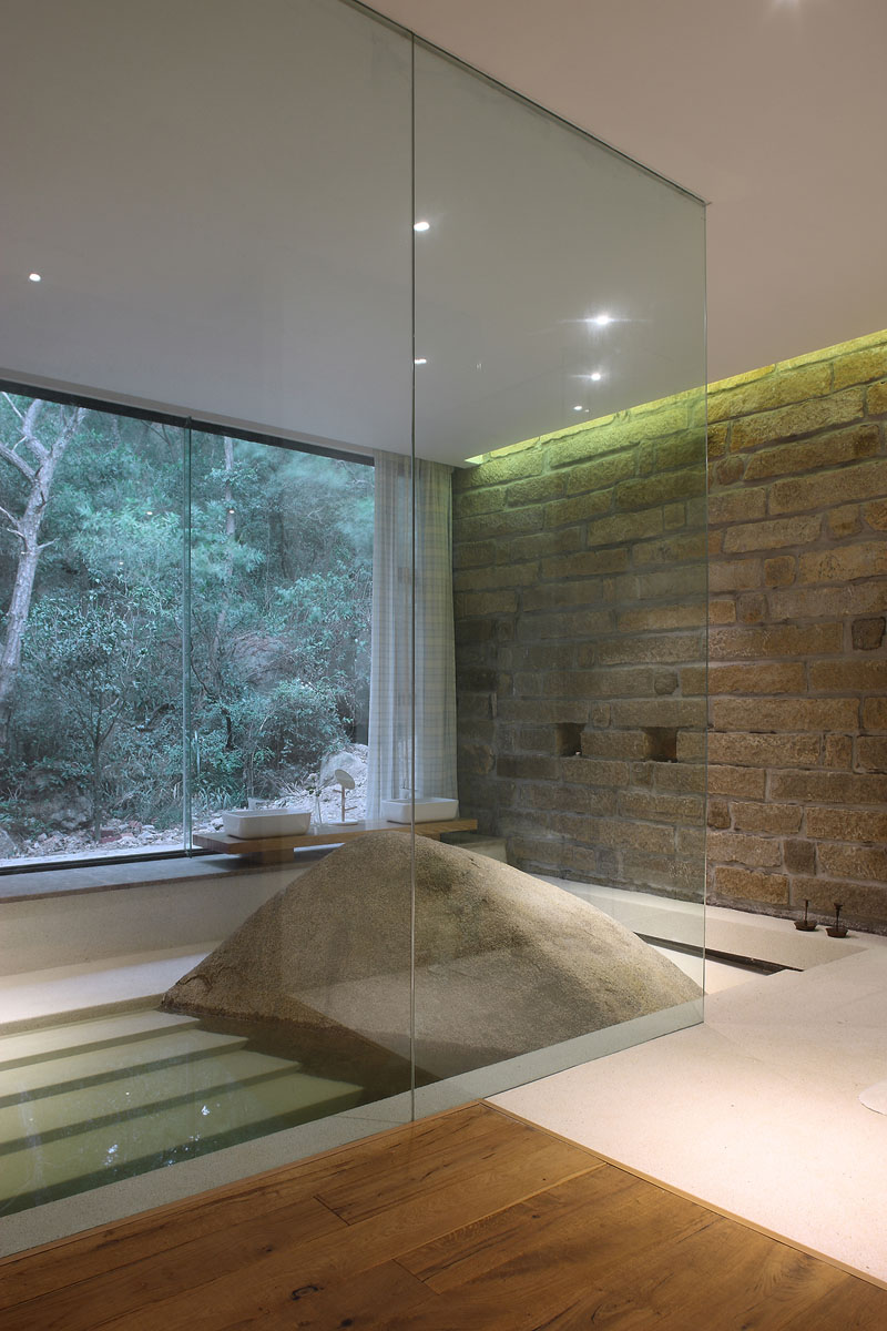 Bring nature inside with a big Boulder In This Bathroom