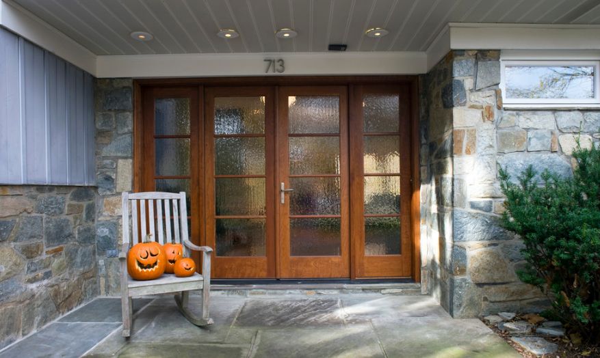 Brown front doors with rain glass