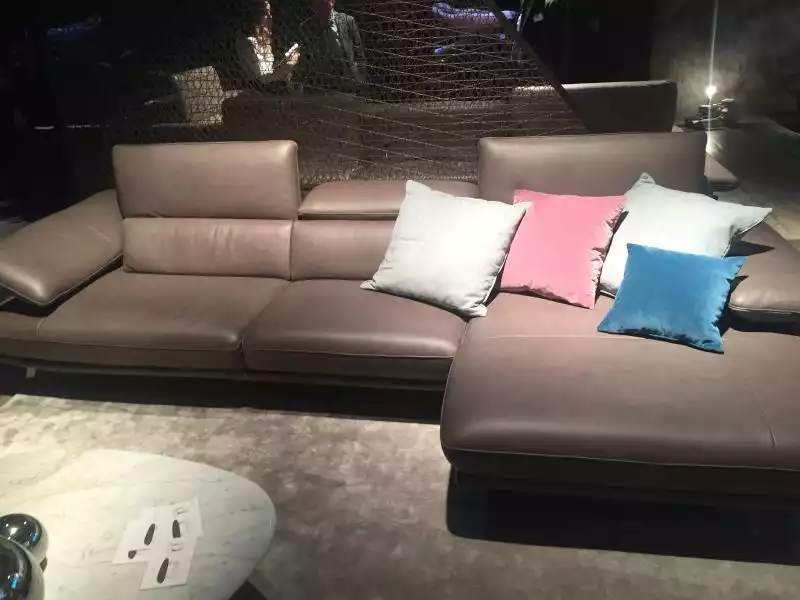 brown-leather-sofa-with-throw-pillows