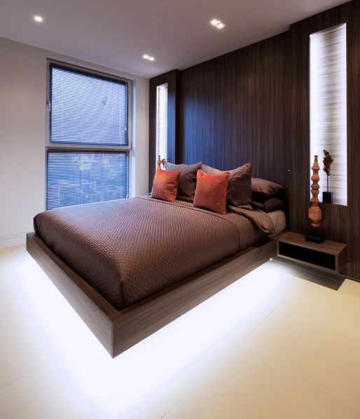 Brown modern bedroom with floating bed