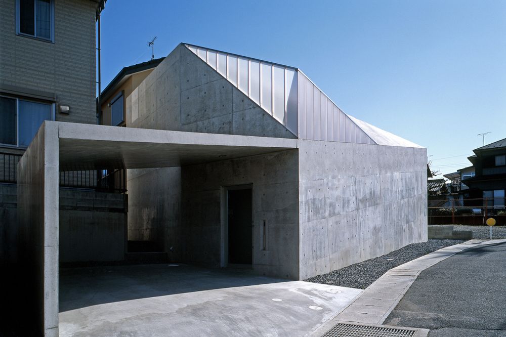 Brutal concrete Hall House 1 by ALPHAVILLE Architects - car garage