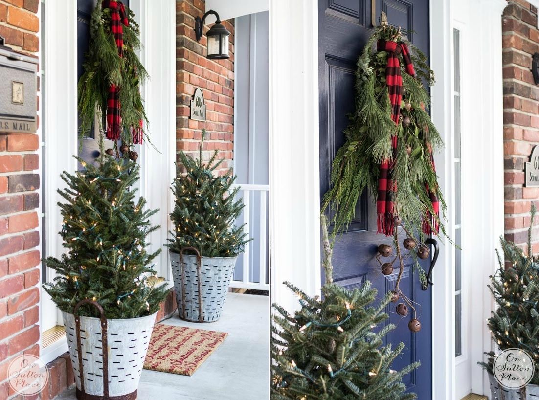 Buckets with small trees on the front of the door