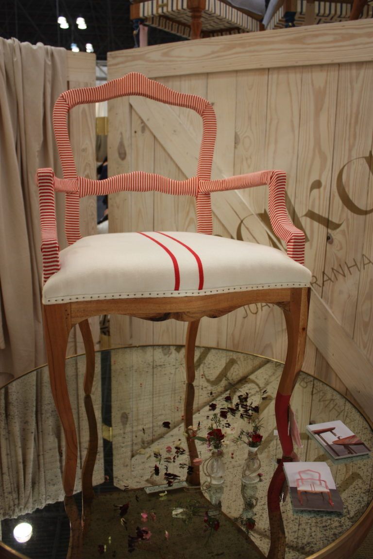The wrapped frame is very distinctive, especially the patterned red fabric.