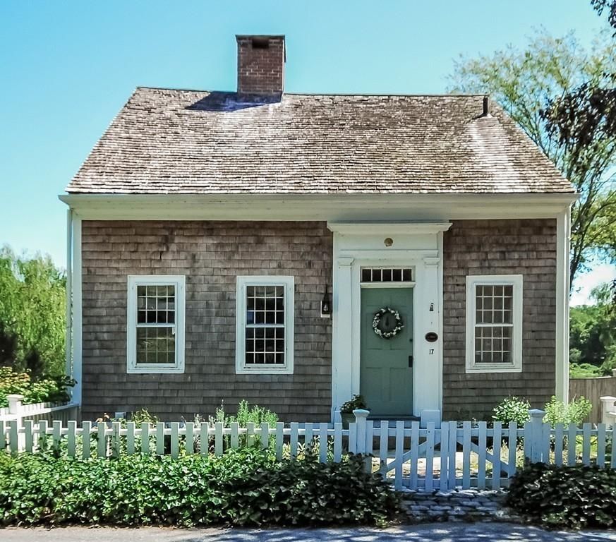 Cape cod home with small fence