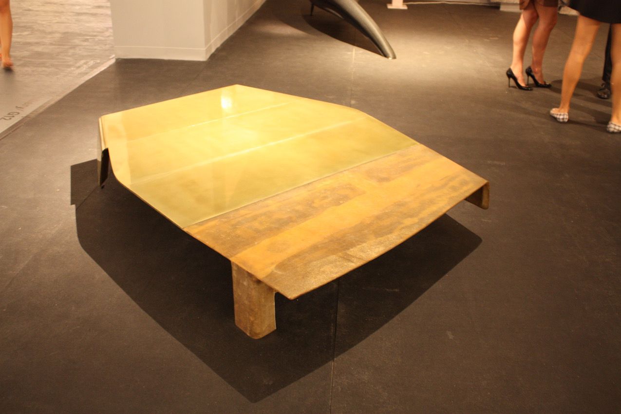 This coffee table from the Carpenter's Workshop Gallery demonstrates that art form doesn't have to limit function. It's not a generic square or rectangular table, but it's highly functional.