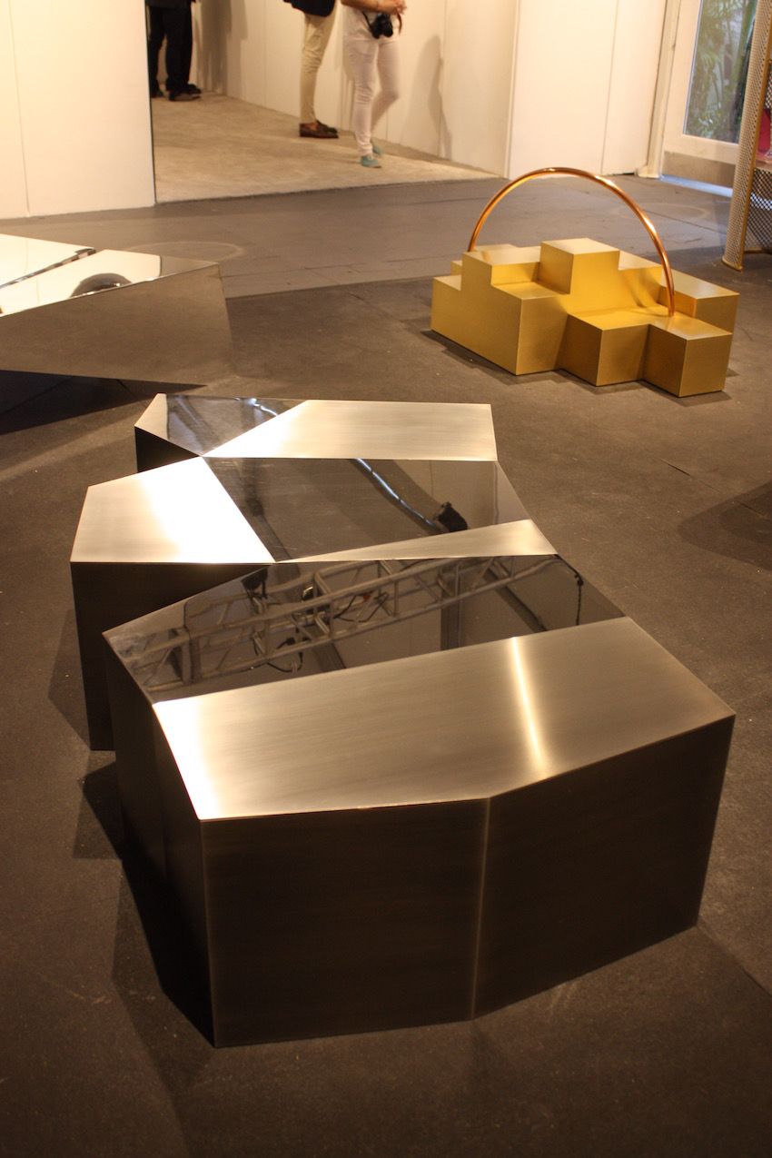 This table is also from Cherkerdjian's Trans Form collection and is made of stainless steel.