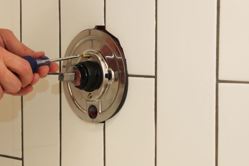 Caulk around the shower fixture