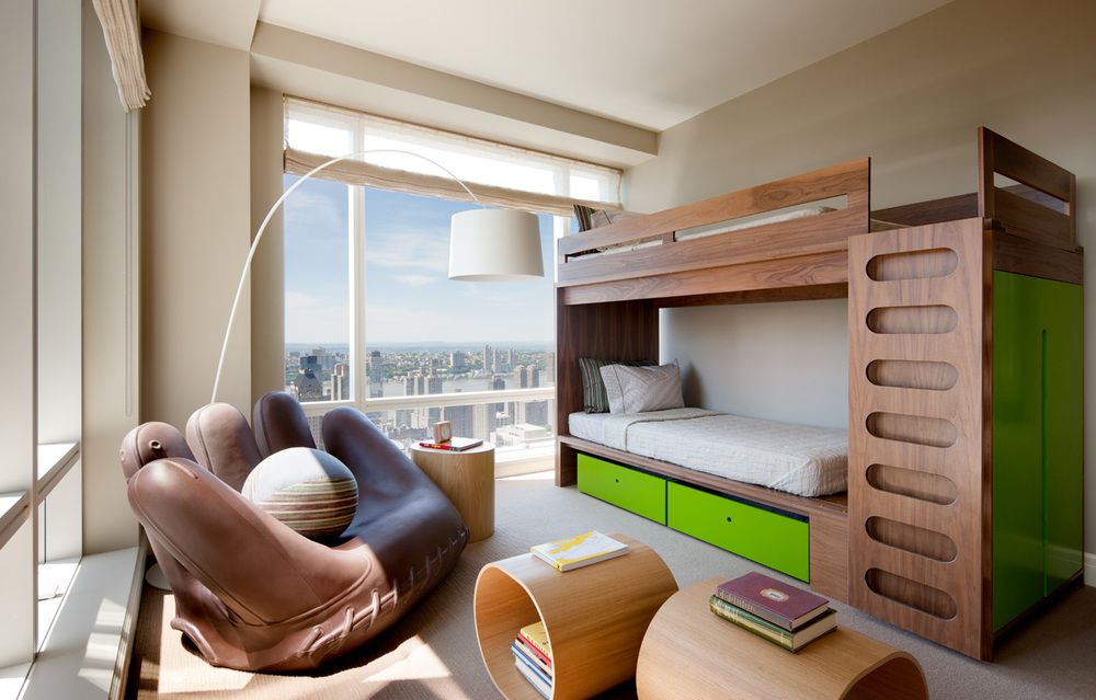 Whimsical and functional without being childish, the boy's bedroom is equipped with spaces for play as well as relaxation.