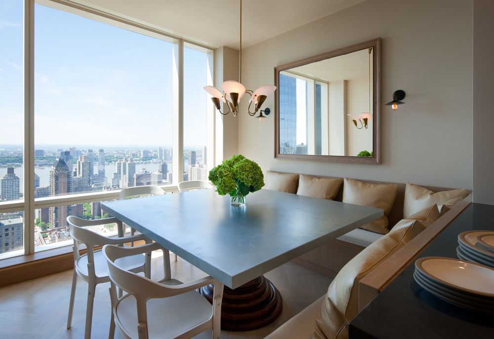 The design of the dining area is elegant and comfortable, without being stuffy. The unique table base is a wonderful addition of wood to the sleek area.