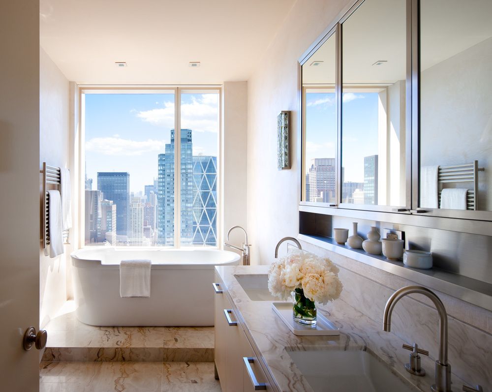 The stunning master bathroom of the Central Park home is relaxing as well as supremely functional, again taking advantage of the spectacular view.
