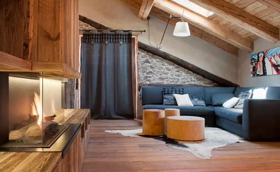 Chalet di Giano Mansard Living room with Fireplace and Wood Beams