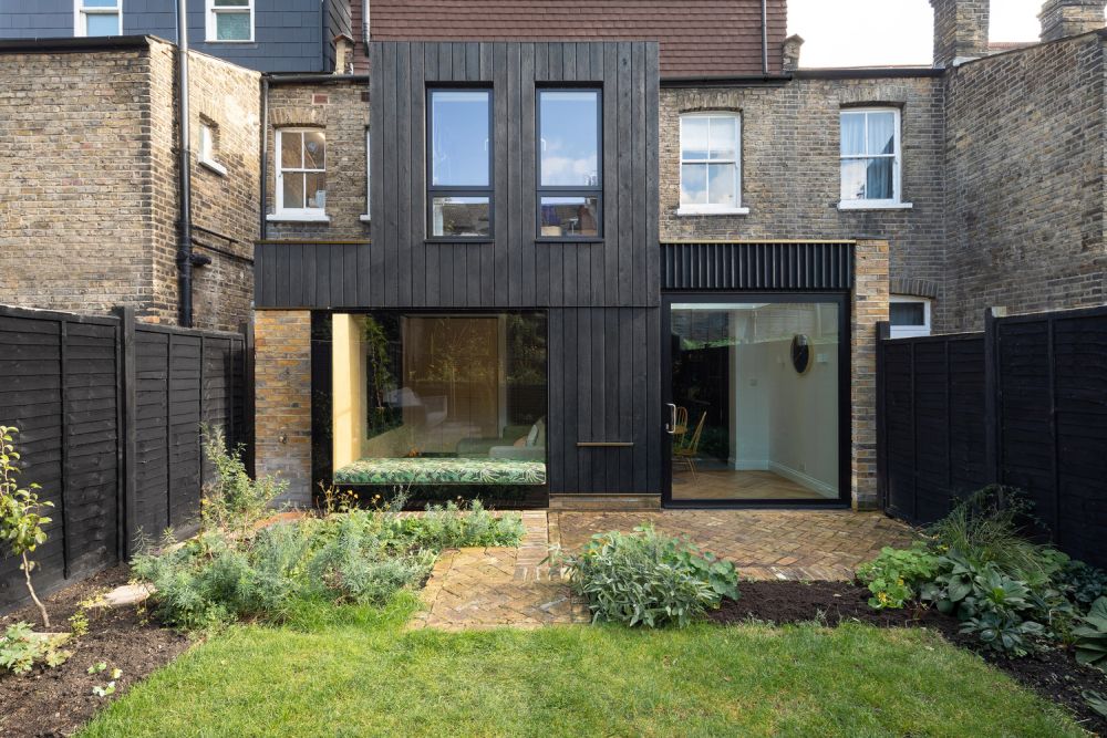 Charred House by Rider Stirland Architects backyard