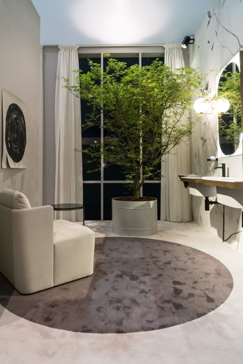 This bathroom space has a vanity and feels like a living room.