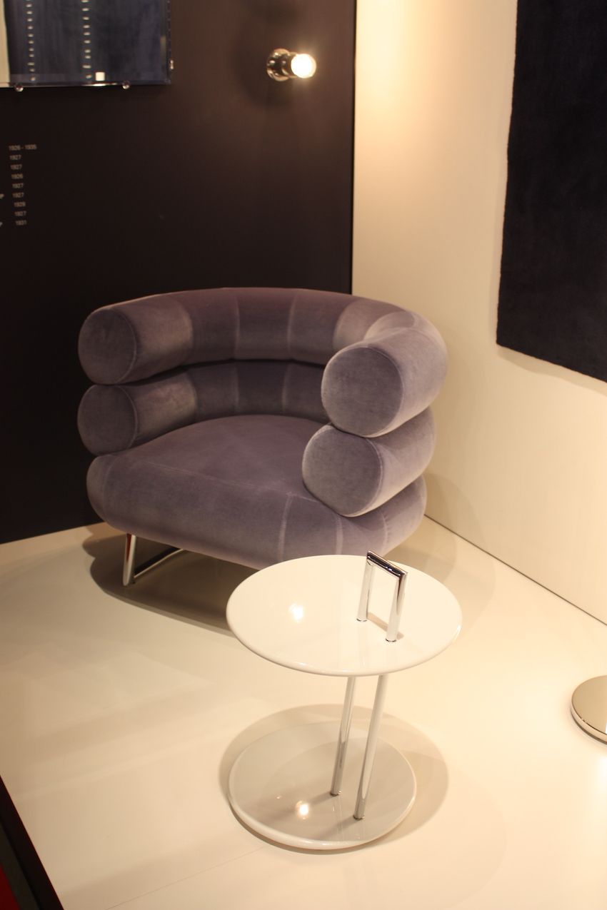ClassiCon's velvet armchair has a deep, distinctive back and a subdued mauve color