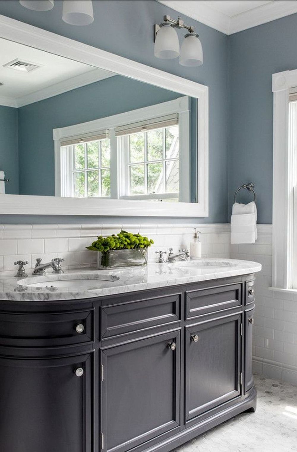 Classic bathroom with blue walls and deep dark vanity