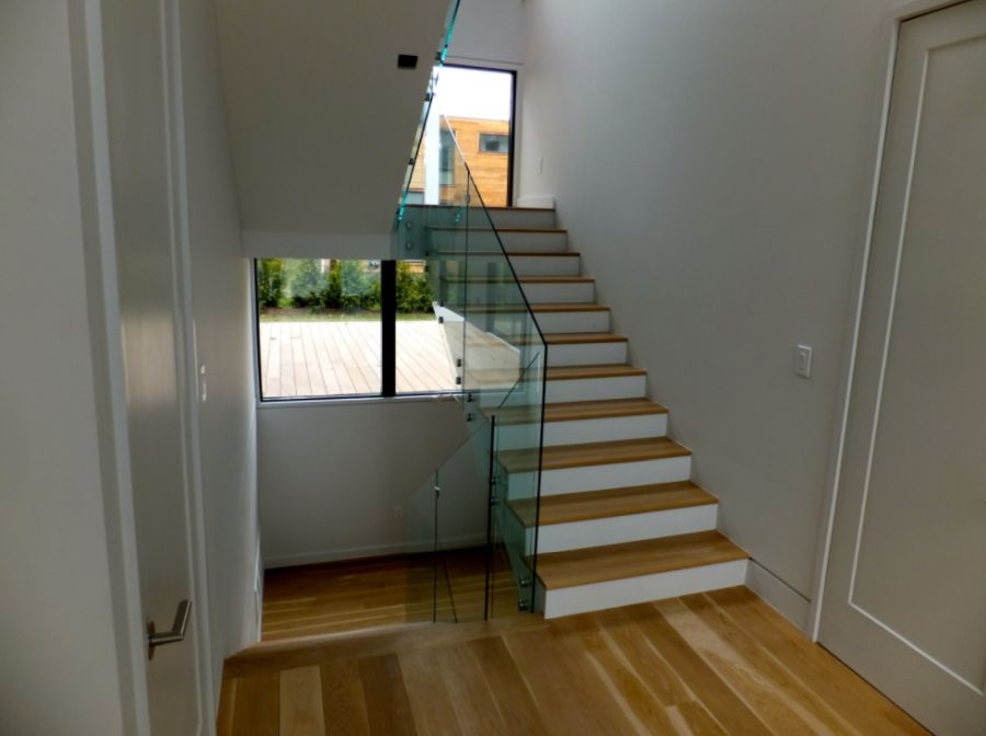 Classic staircase with modern glass railing