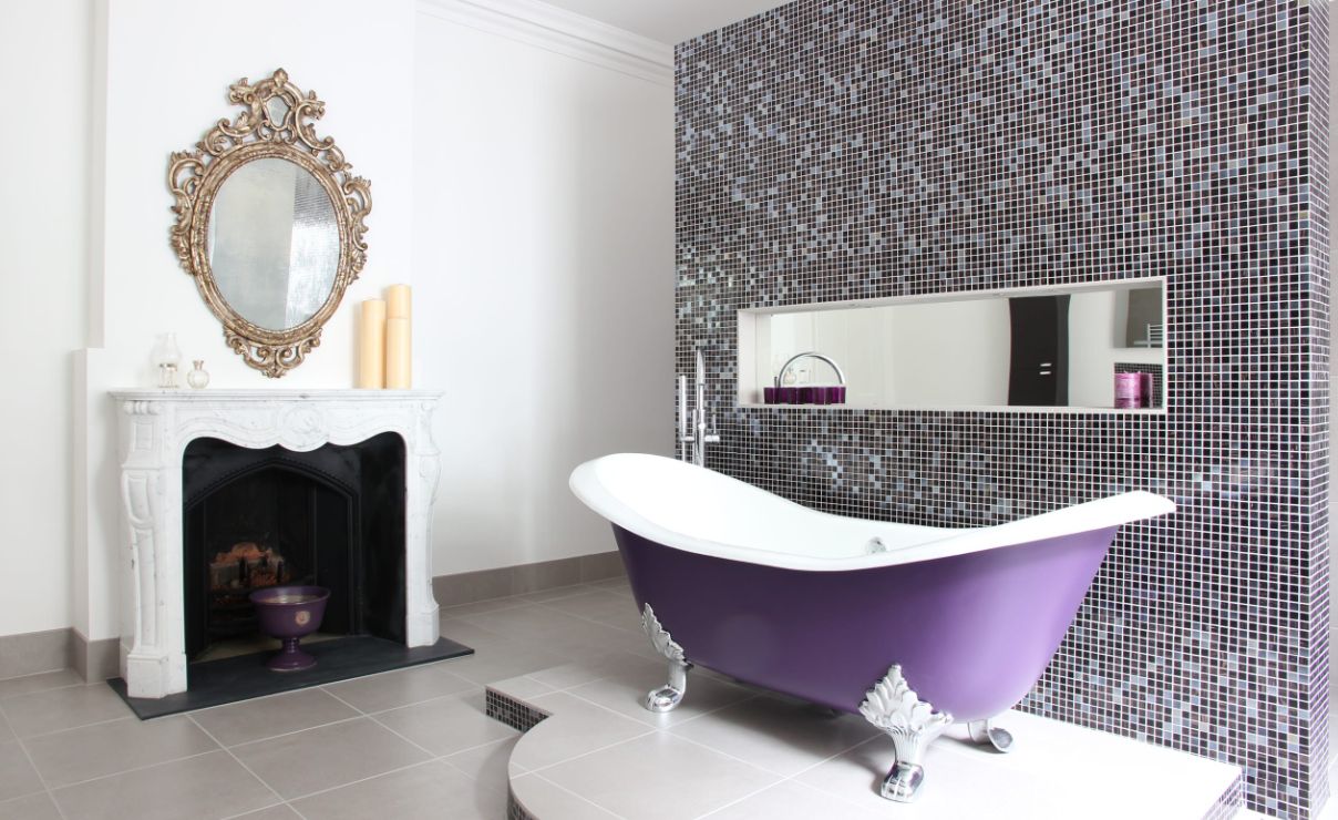 Modern bedroom with purple accent pillows