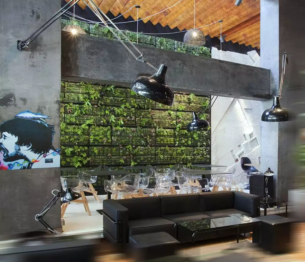 An Athens coffee shop uses green walls to create the impression of being in a garden.