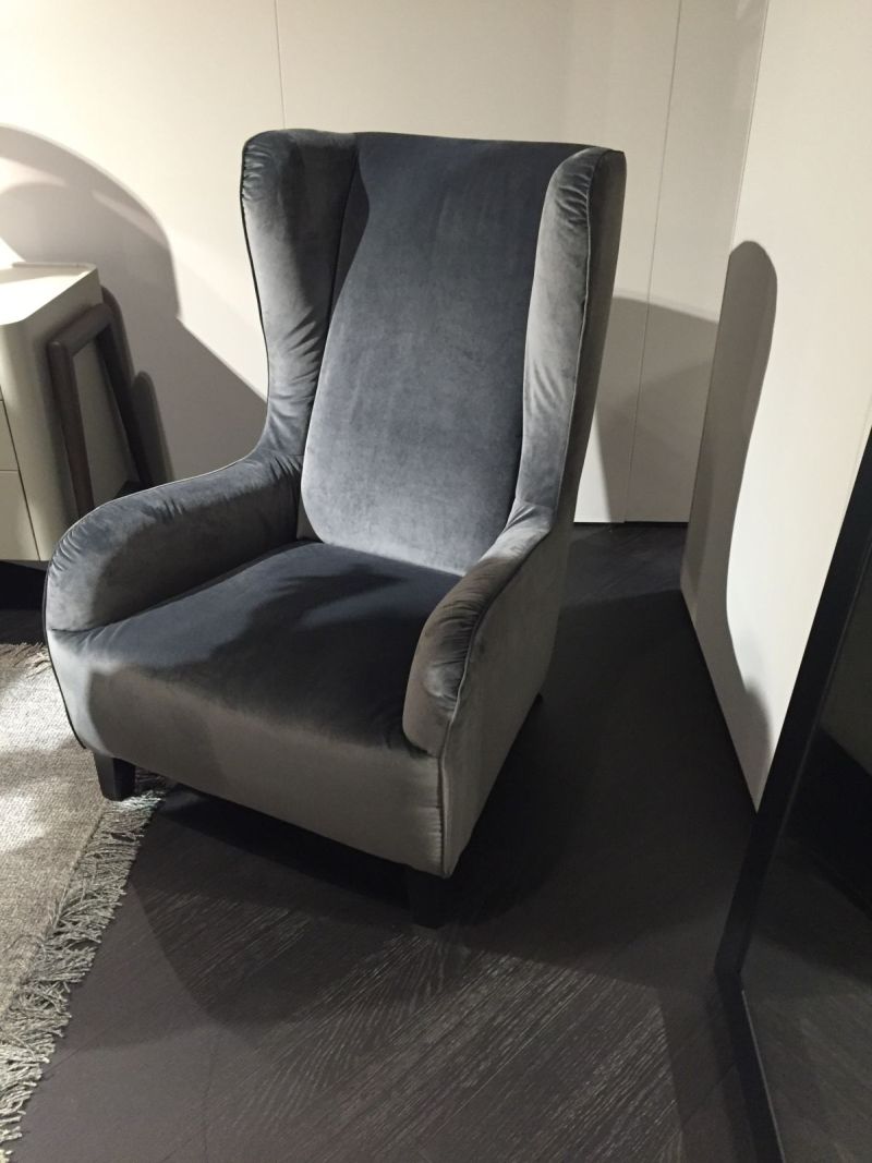 Comfortable velvet grey armchair