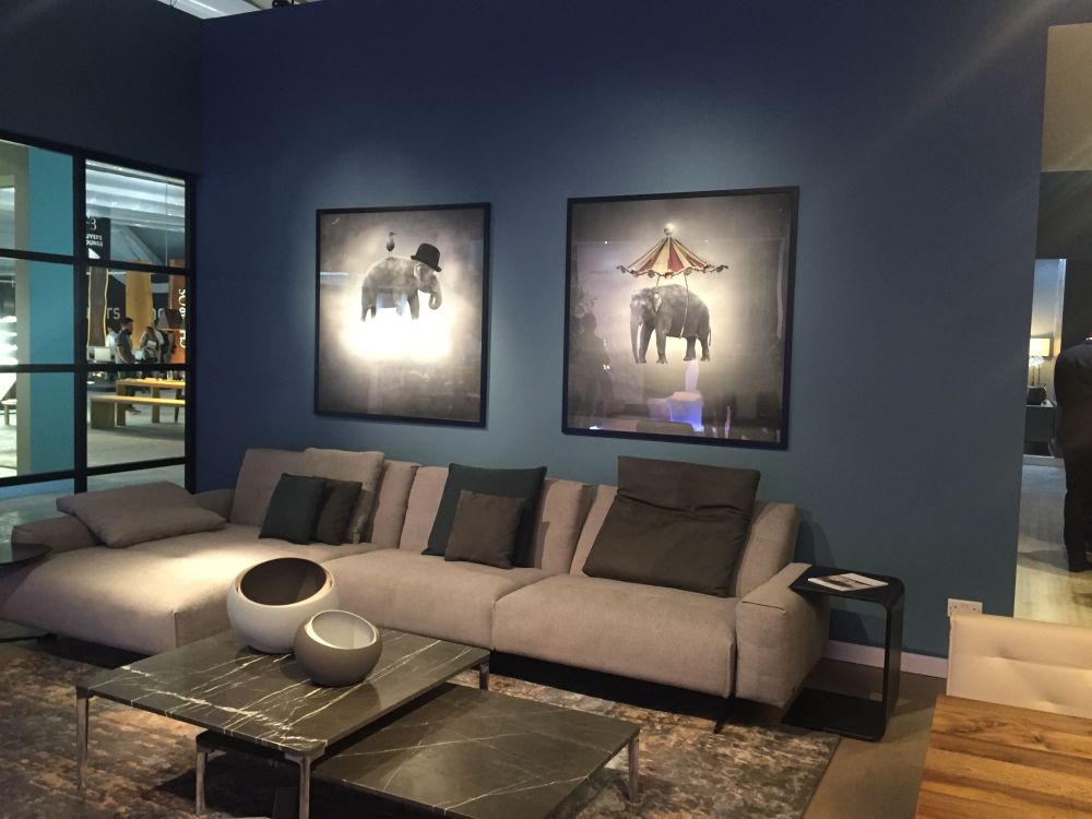 Community Space grey living room sofa and modern frames above