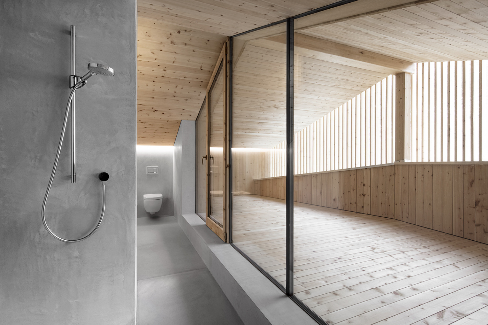 Concrete walls shower and wood accents