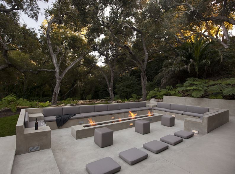 Contemporary Glass Pavilion House with Outdoor Fire Pit Seating Concrete Furniture
