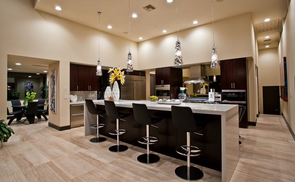 Contemporary open space kitchen wtih black counter stools