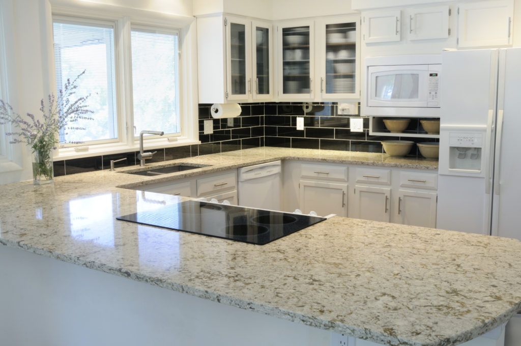 Contemporary quartz countertop design with subway tiles