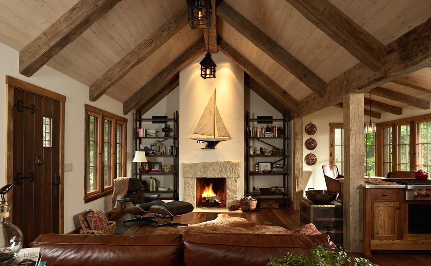 Cool rustic living room with cathedral ceiling and iconic eames lounge chair