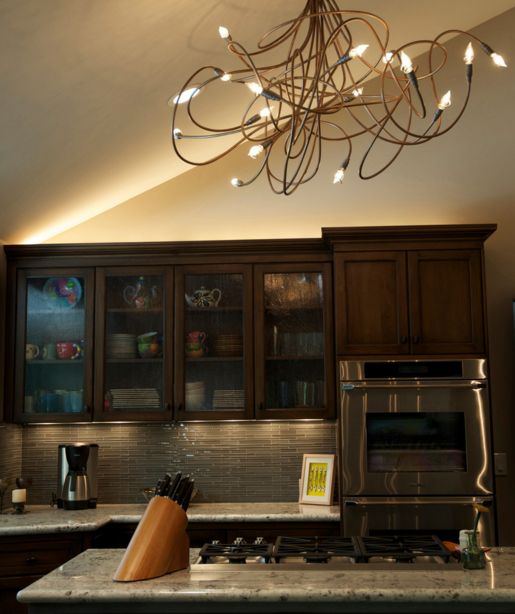 Copper chandelier over the kitchen island