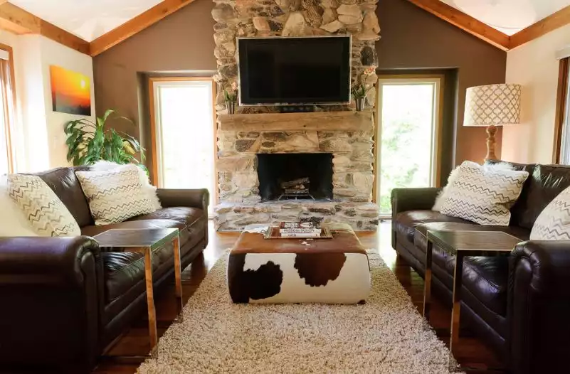 Cowhide ottoman coffee table for a rustic living room